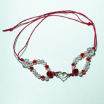 Βραχιόλι με ακρυλικη χάντρα και μεταλλικό στοιχείο σε σχοινακι